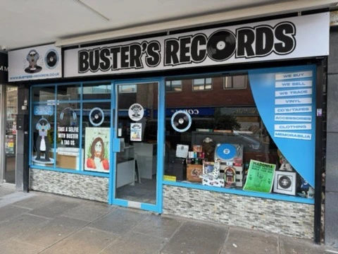Buster’s Records shopfront with branded fascia and window graphics