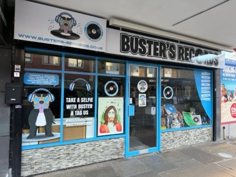 Buster’s Records installed shop signage and window graphics